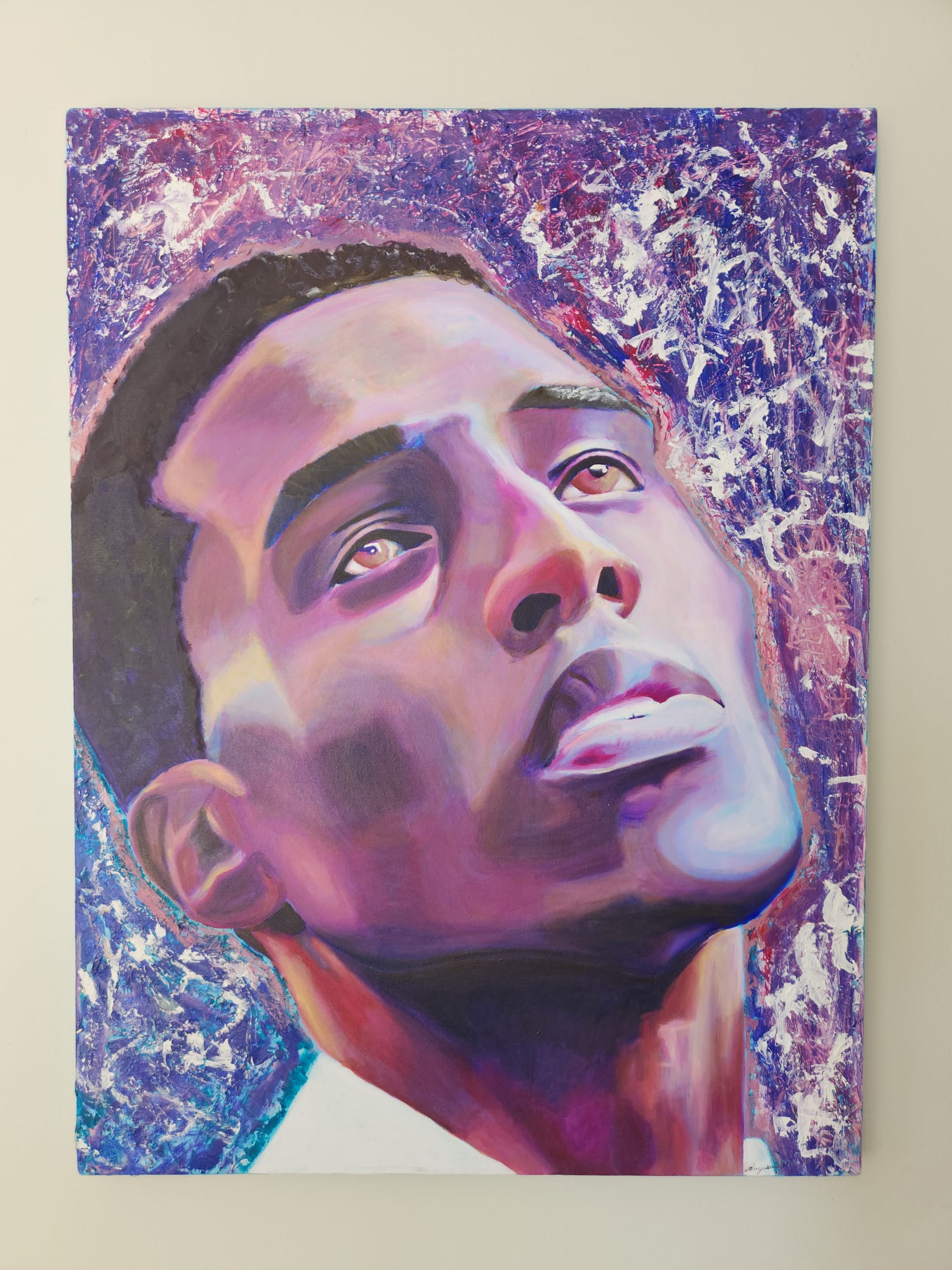 Portrait of a man with his face tilted upward and eyes gazing up, painted in vivid purples, magentas and pinks against a textured violet and white background